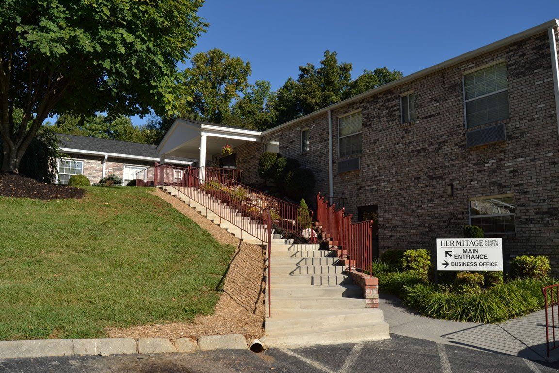 A brick building with stairs leading up to it