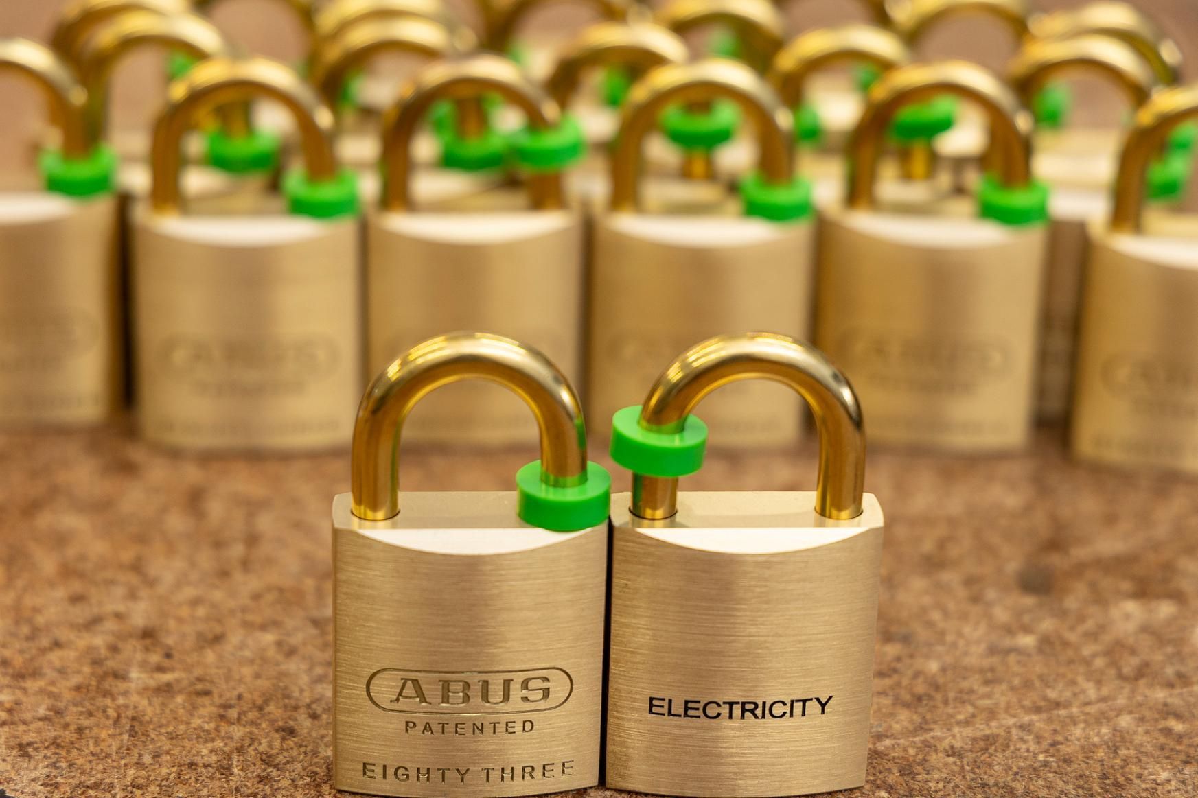 Golden Padlocks With Green Protective Rings; One Reads 