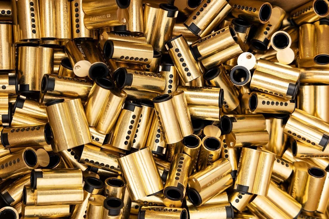 Pile of Shiny Gold-colored Lock Cylinders, Suggesting a Bulk of Hardware Components — Active 24/7 Locksmith and Security Services in Gloucester, NSW