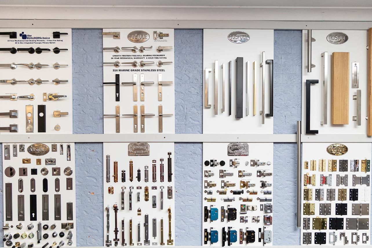Display of Various Door Hardware Samples Mounted on a Wall — Active 24/7 Locksmith and Security Services in Forster, NSW