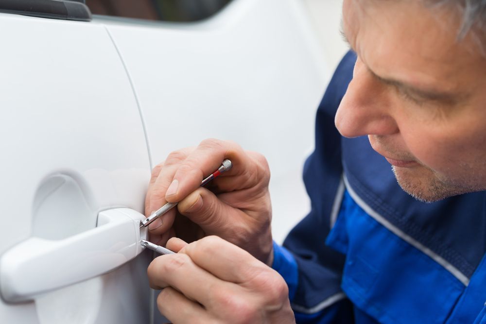 Locksmith Picking a Car Door Lock With Tools — Active 24/7 Locksmith and Security Services Forster In Wingham, NSW