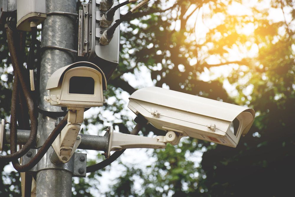 A Couple of Security Cameras Sitting on Top of A Pole  — Active 24/7 Locksmiths Forster In Forster, NSW