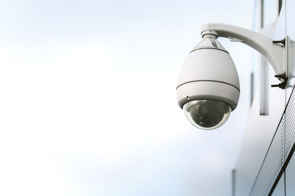 A Security Camera Is Mounted on The Side of A Building — Active 24/7 Locksmiths Forster In Old Bar, NSW