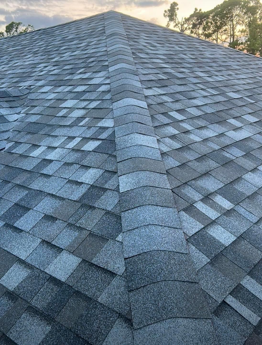 A close up of a roof with shingles on it.