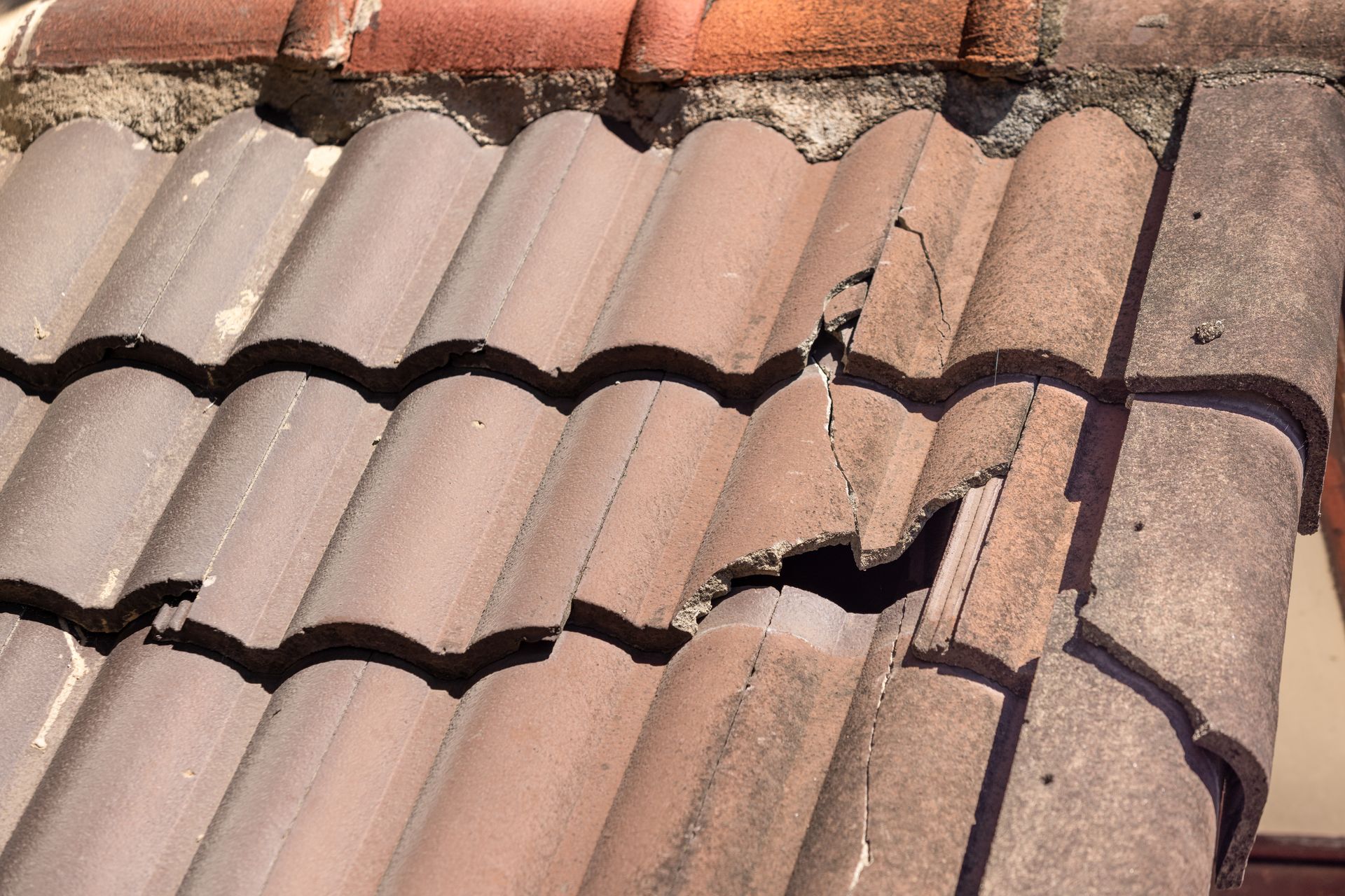 A close up of a roof with a hole in it