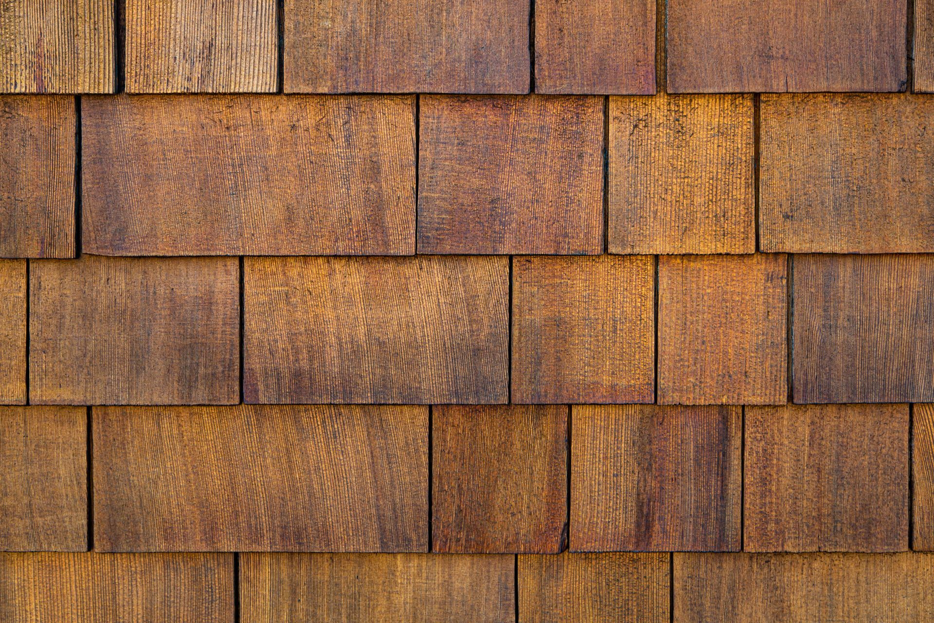 A close up of a wooden shingle roof.