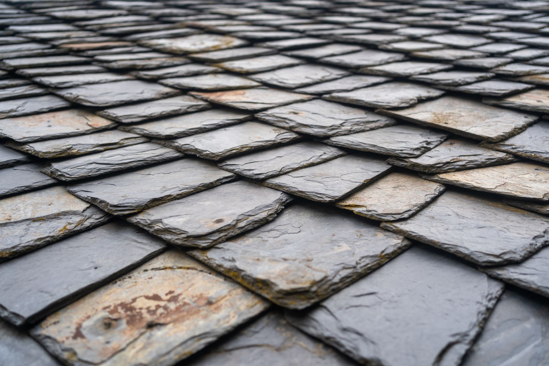 A close up of a roof made of slate tiles.