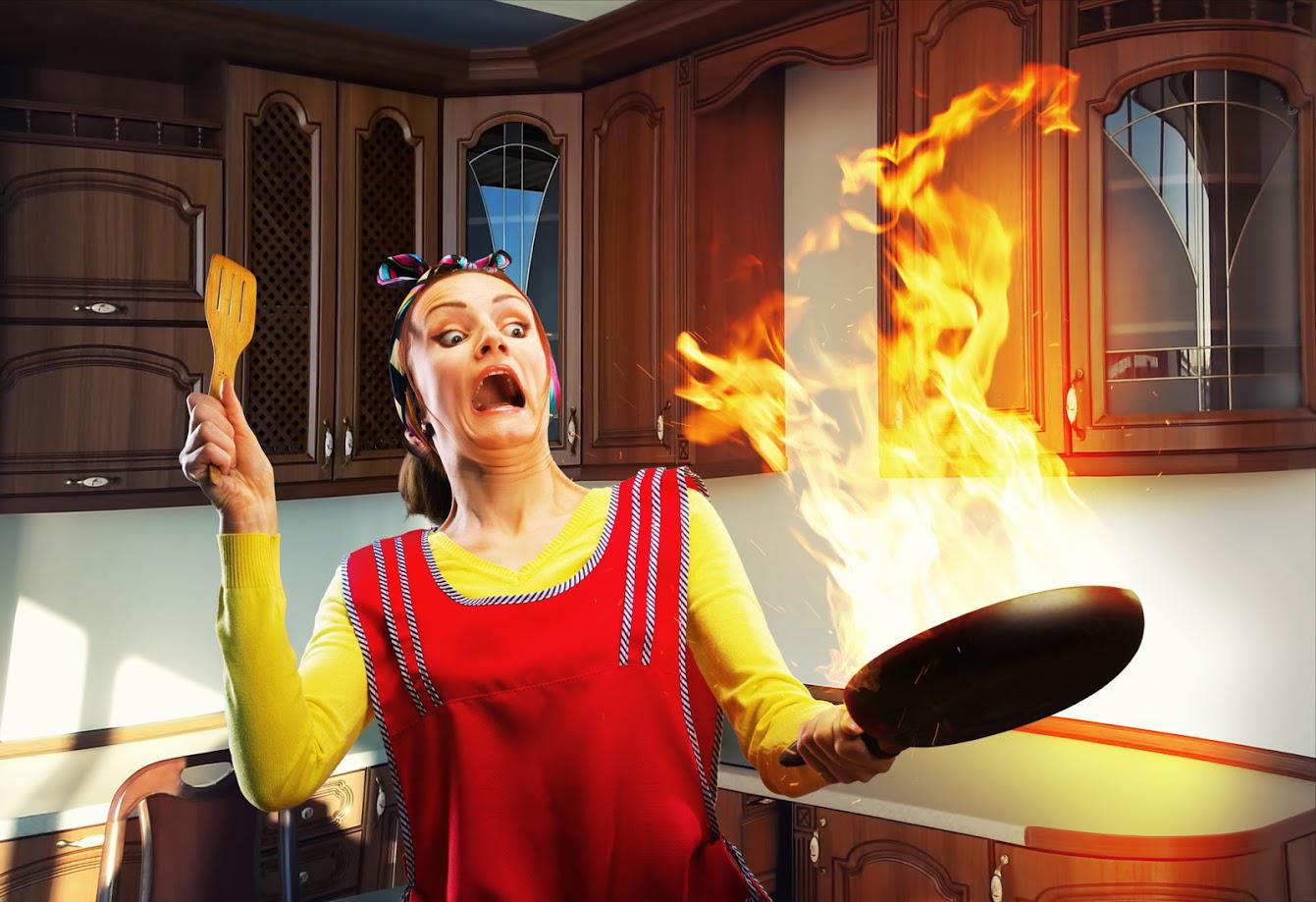 Home Flammables — Woman Holding A Frying Pan With Fire In It in American Fork, UT