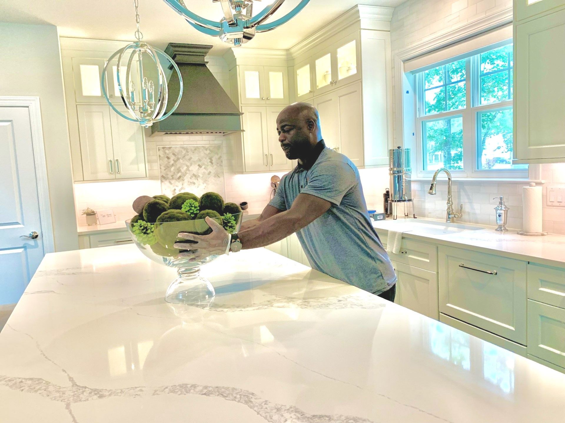 Man standing in front of a kitchen island — Feasterville, PA — Moving Makeover LLC
