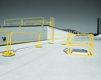 Yellow safety railings and ladder on a flat roof.