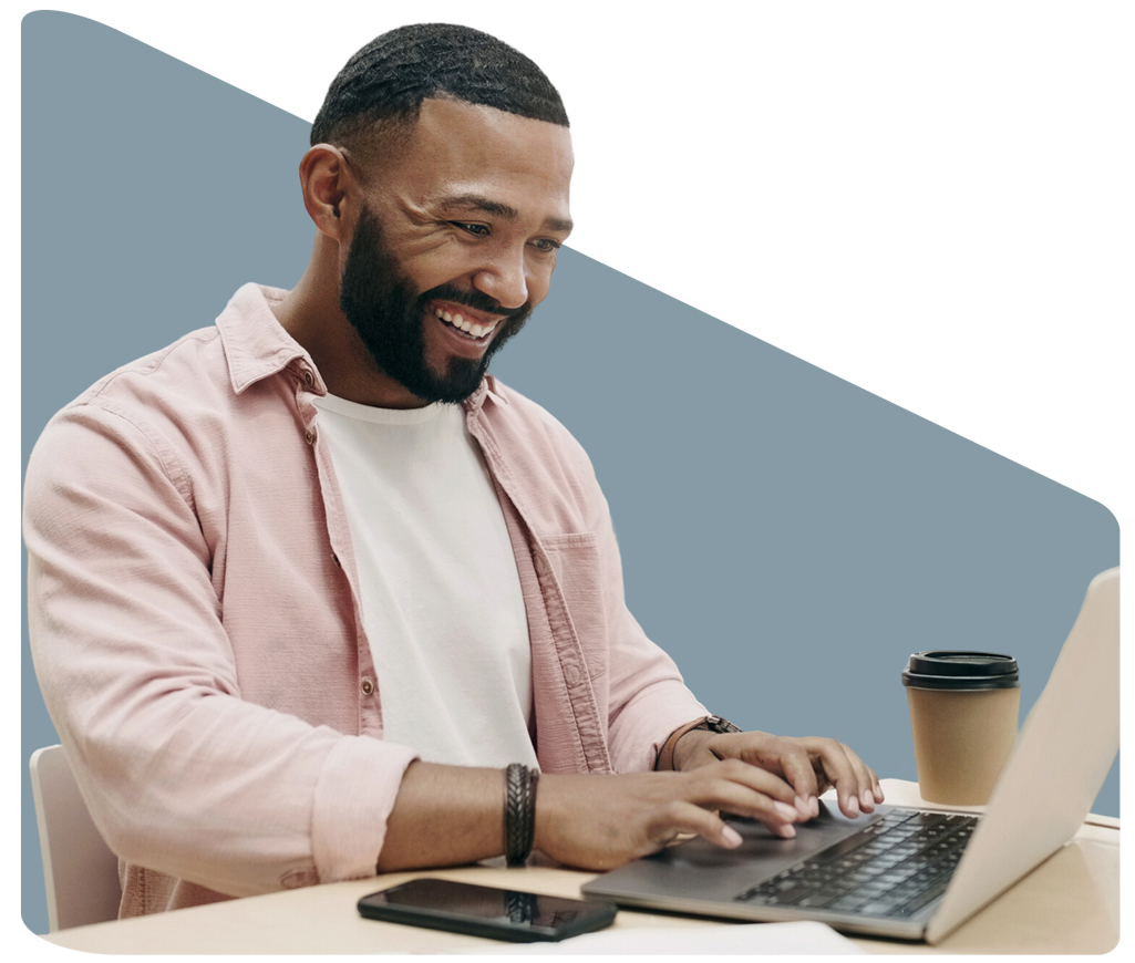 A man sitting at a desk using a tablet — Jacksonville, FL — VipVap