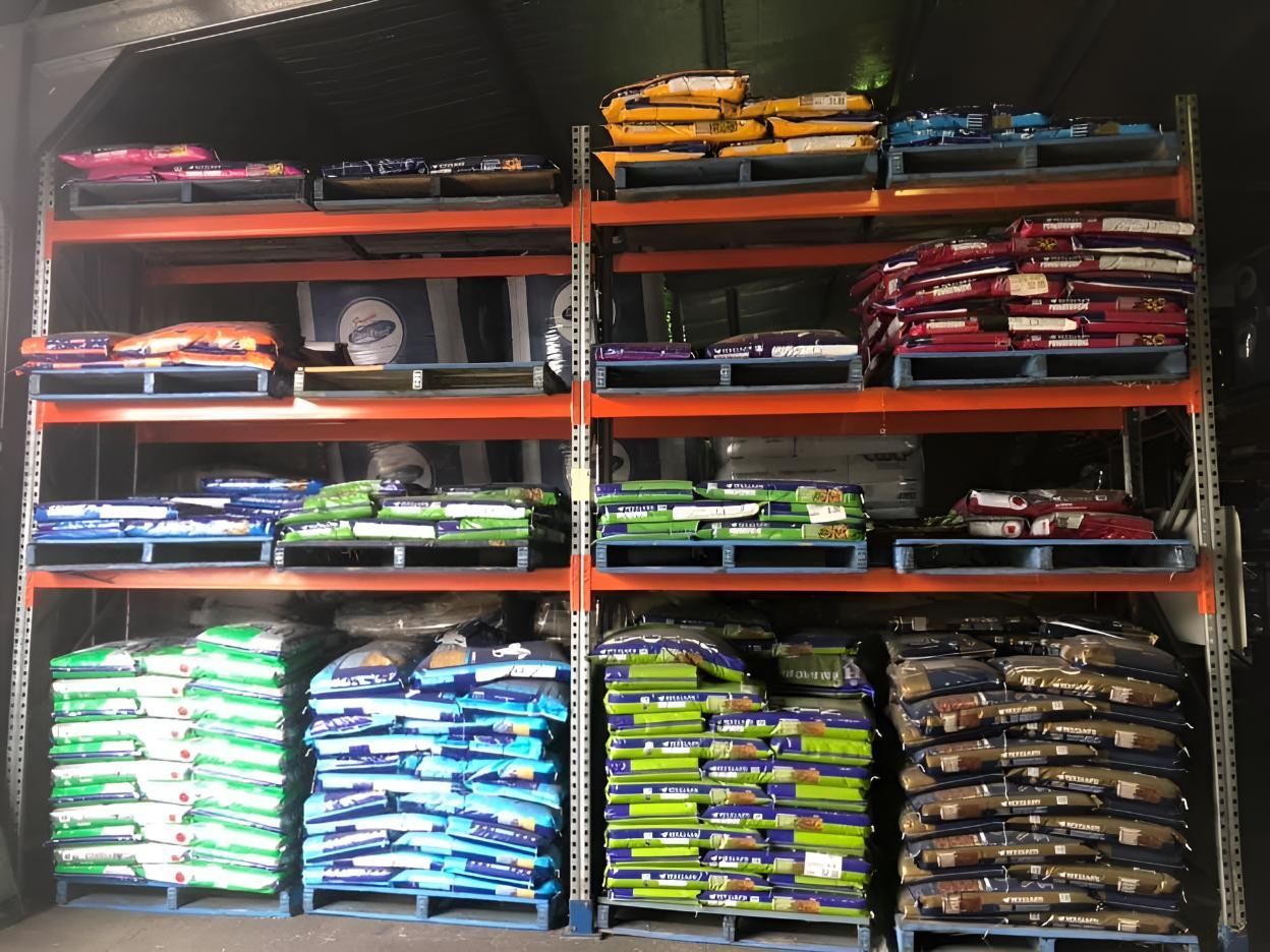 A Warehouse Filled With Lots of Bags of Animal Food — MacCallum & Company In Scone, NSW