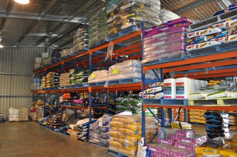 A Large Warehouse Filled With Lots of Bags and Pallets — MacCallum & Company In Scone, NSW