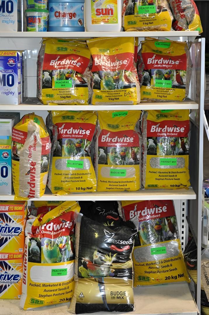 A Shelf Filled With Bags of Bird Food in a Store  — MacCallum & Company In Scone, NSW