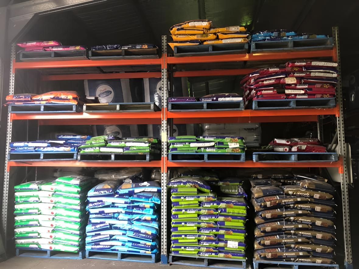 A Warehouse Filled With Lots of Bags of Dog Food  — MacCallum & Company In Scone, NSW