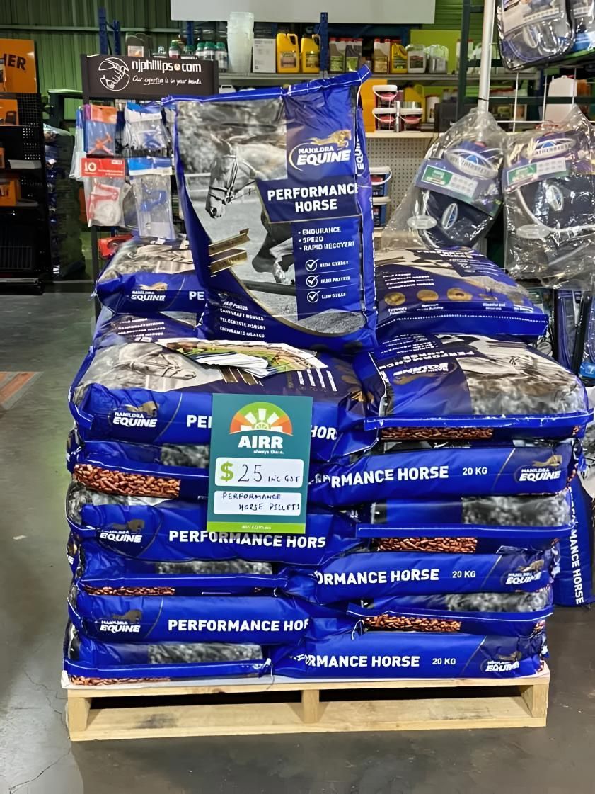 A Wooden Pallet Filled With Bags of Horse Food in a Store — MacCallum & Company In Muswellbrook, NSW