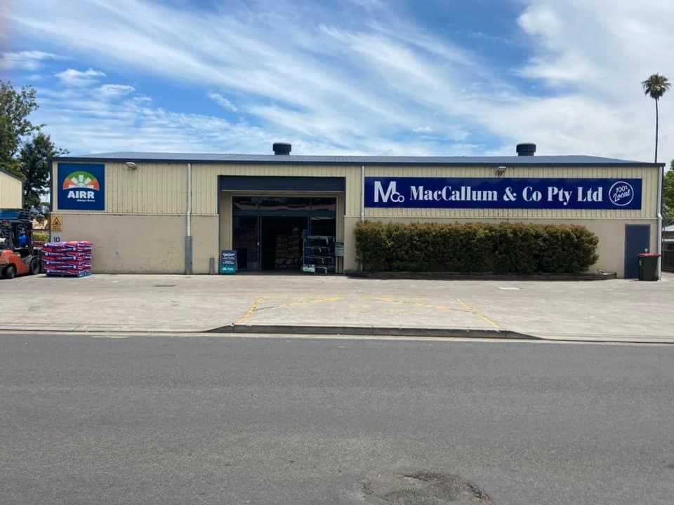A Large Building With a Blue Sign That Says Mco Marcallum & Co Pty Ltd — MacCallum & Company In Scone, NSW