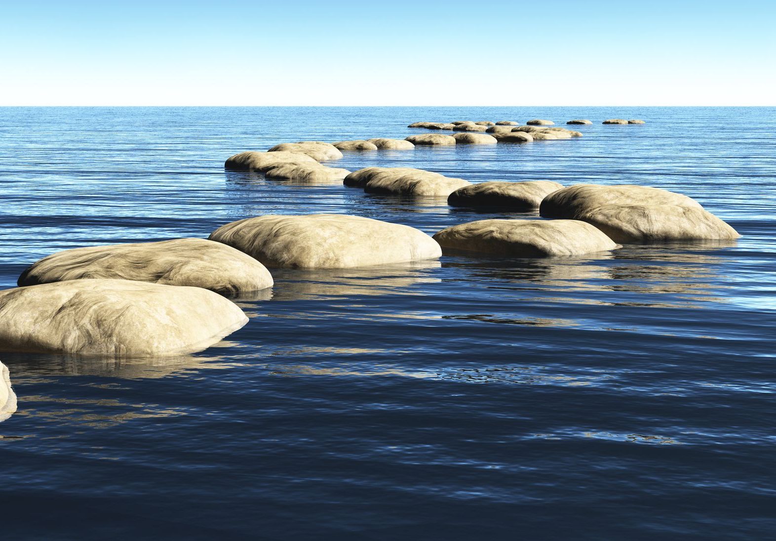 A row of rocks floating on top of a body of water