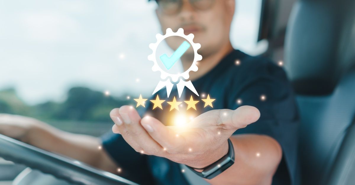 A blurred truck driver holds out a hand as a digital quality badge with a checkmark and five stars glows above it.