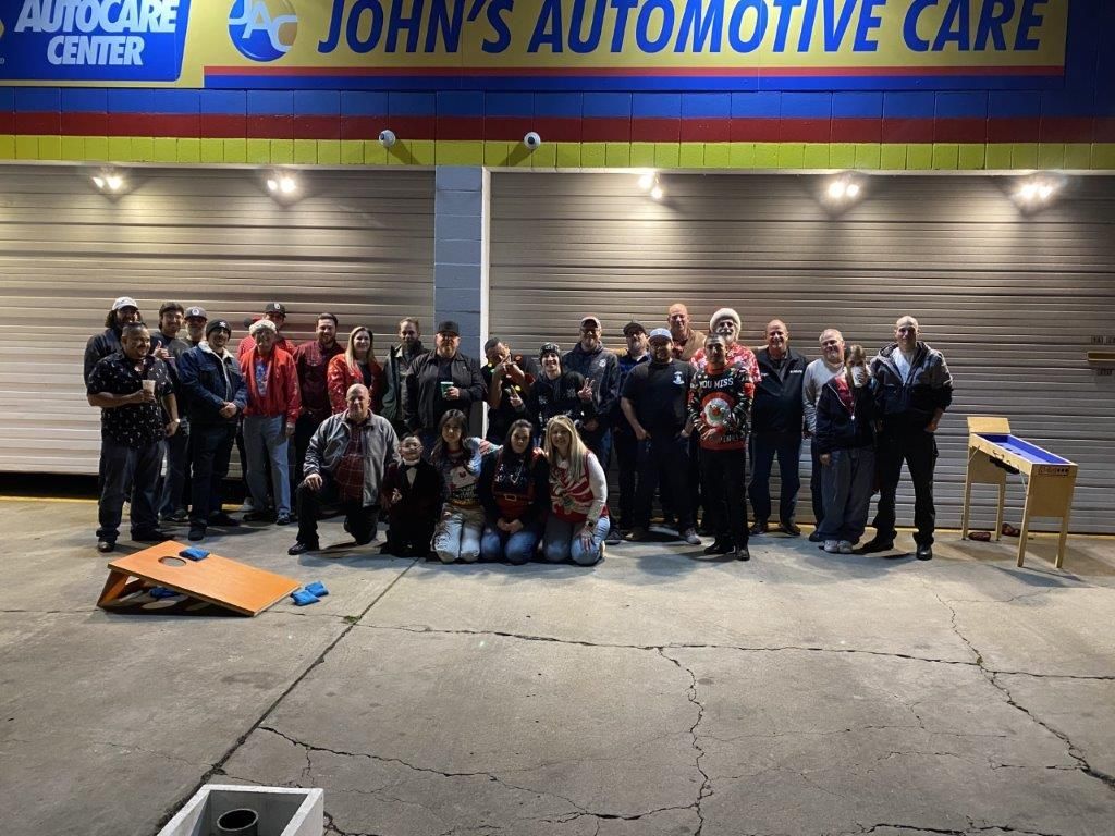 Group of people posing in front of 