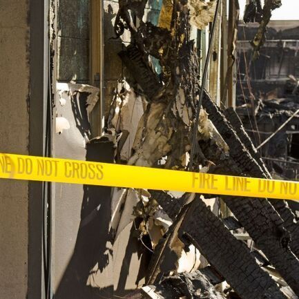 A yellow tape that says do not cross on it
