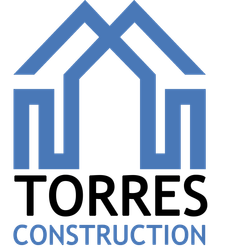 A blue and black logo for torres construction