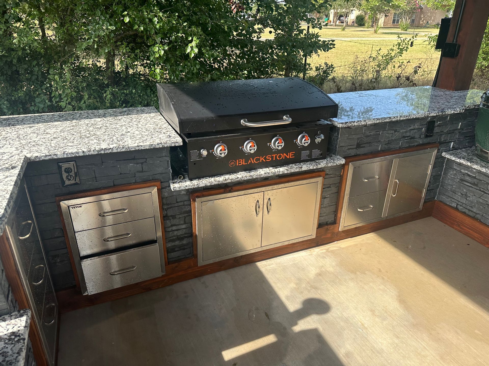 There is a grill in the middle of the kitchen.