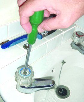 Plumbing services - Amersham - PFM Chiltern - Fixing tap
