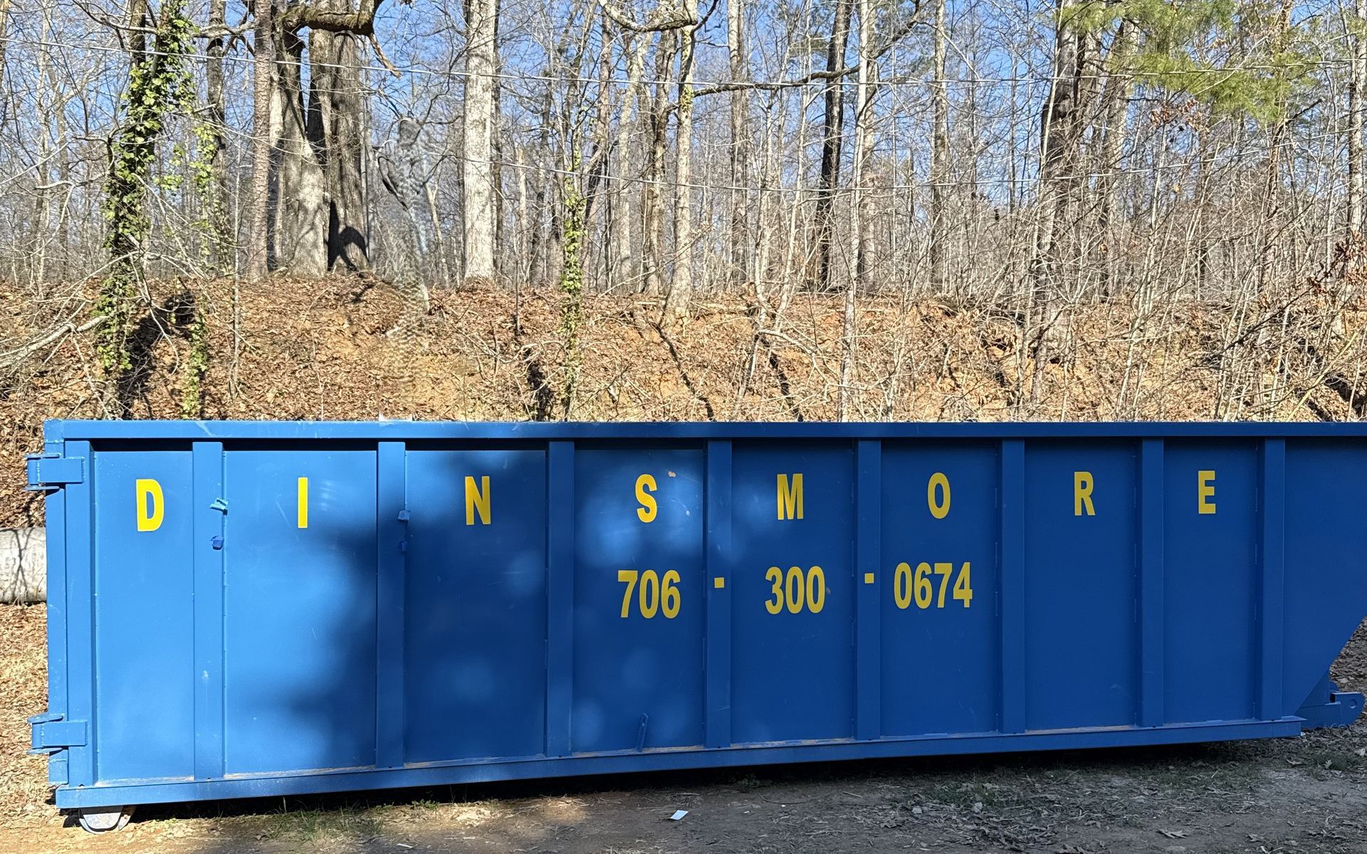 Blue dumpster with 