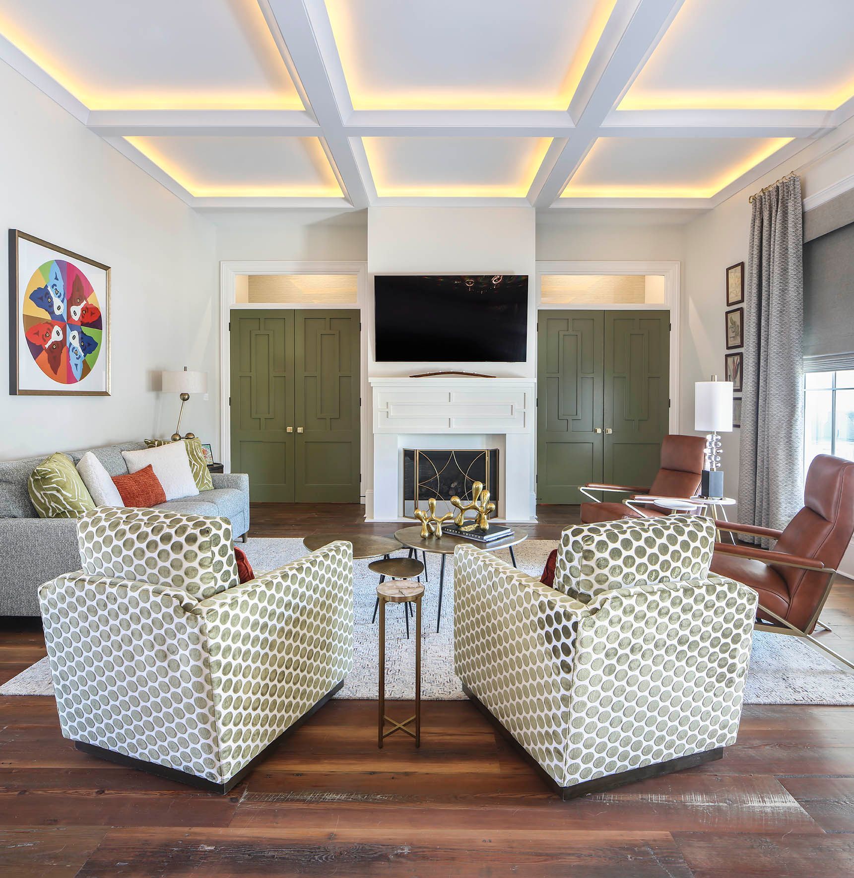 Outdoor living space with beige sofa, black coffee table, and views of a pool and neighborhood.