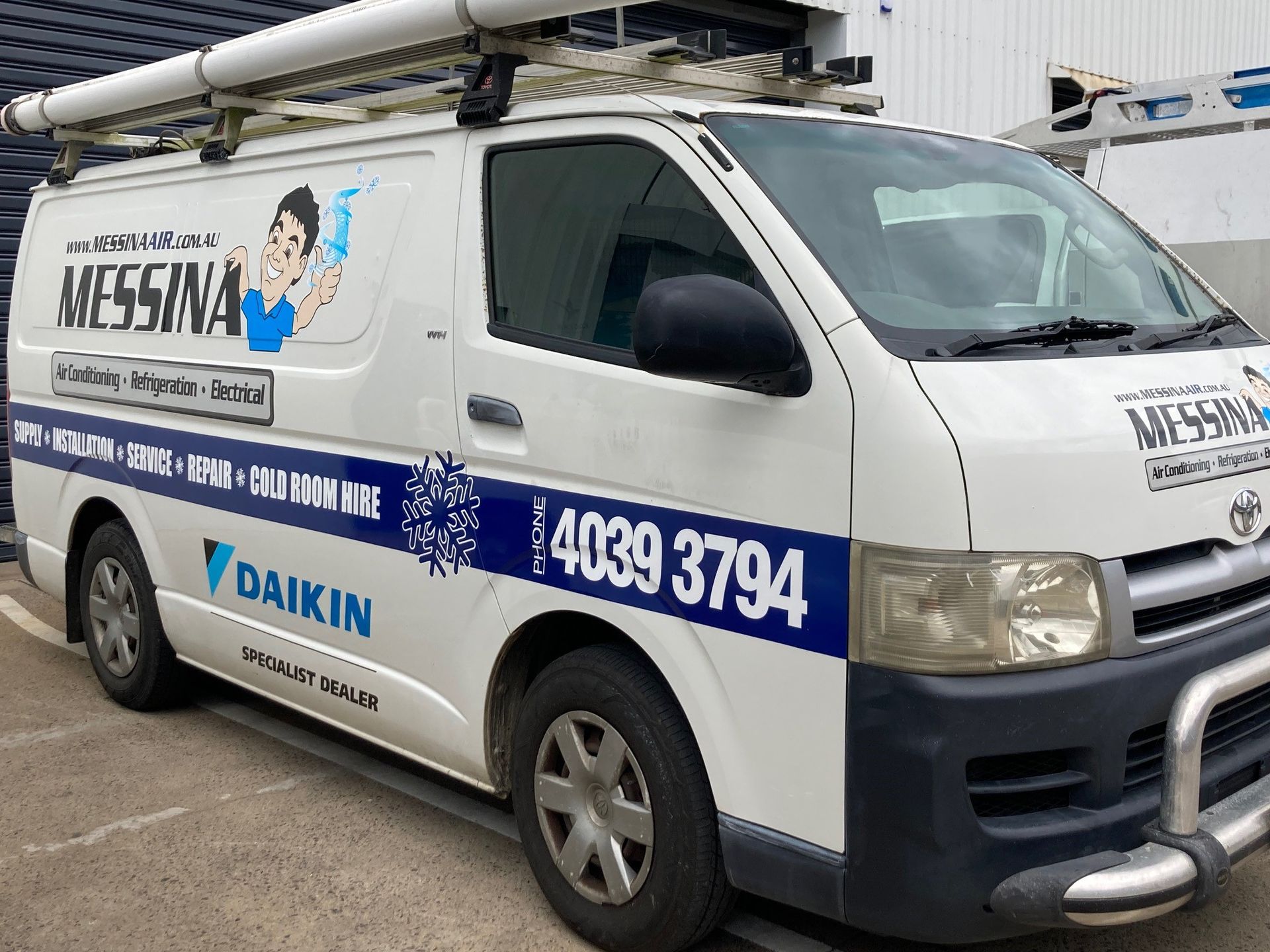 Hands Using a Drill to Repair Air Conditioning Unit — Messina Air Conditioning & Electrical in Portsmith, QLD