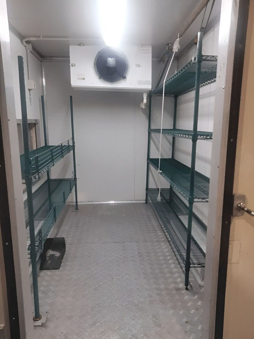 Inside a Walk-In Cooler with Shelves and A Cooling Unit — Messina Air Conditioning & Electrical in Portsmith, QLD