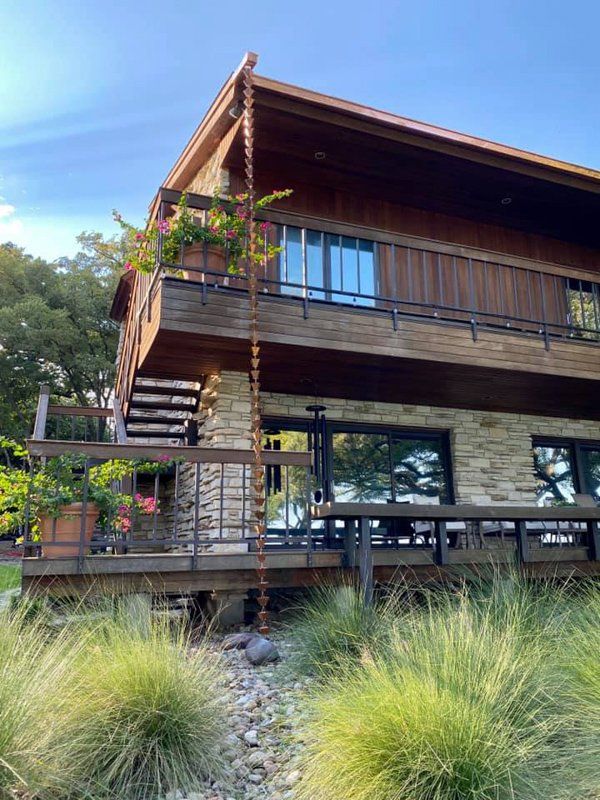 A rain chain installation in Fort Worth, TX by PT Gutters