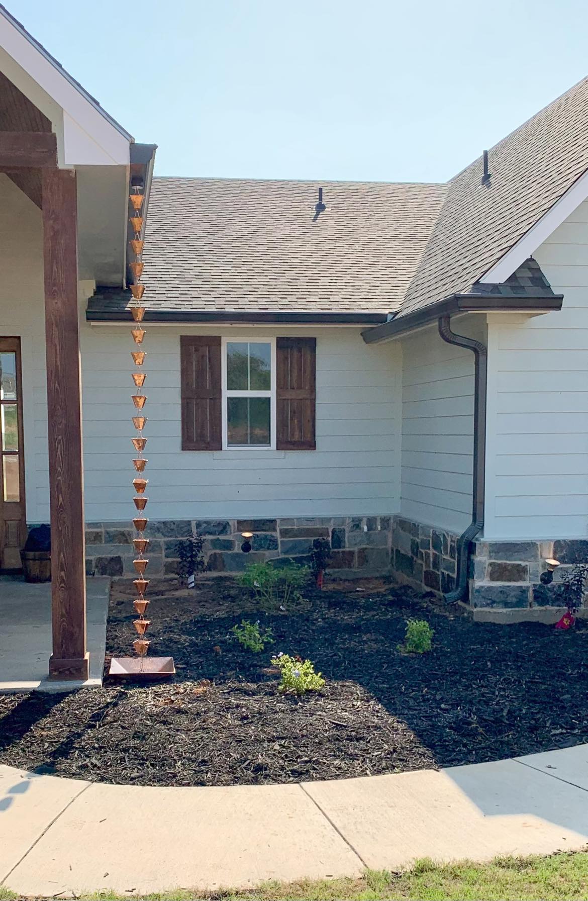 A rain chain installation in Fort Worth, TX by PT Gutters