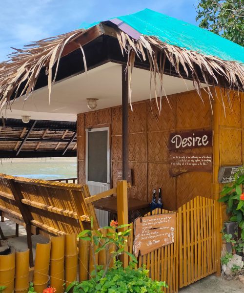 Bungalow with bamboo walls and a thatched roof, labeled 