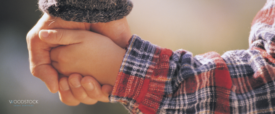 Child holding parents hand showing affect of Media reporting on family cases in court