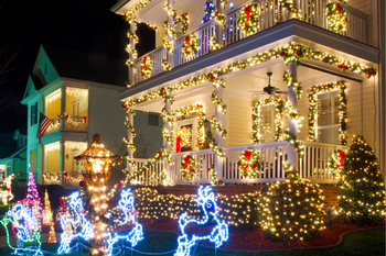 A house is decorated for christmas with lots of lights and decorations.