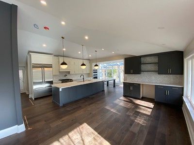 A kitchen with a large island in the middle of the room.