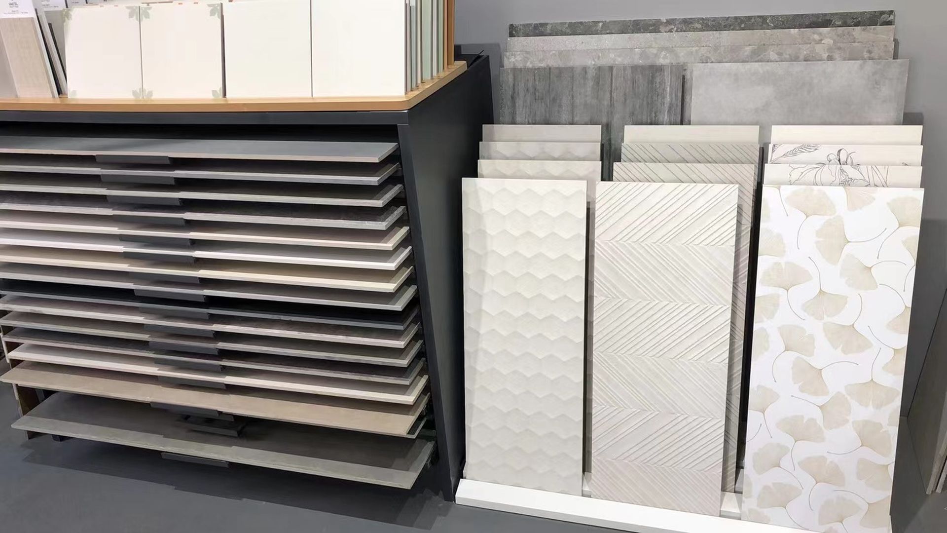 There are many different types of tiles on display in a store.