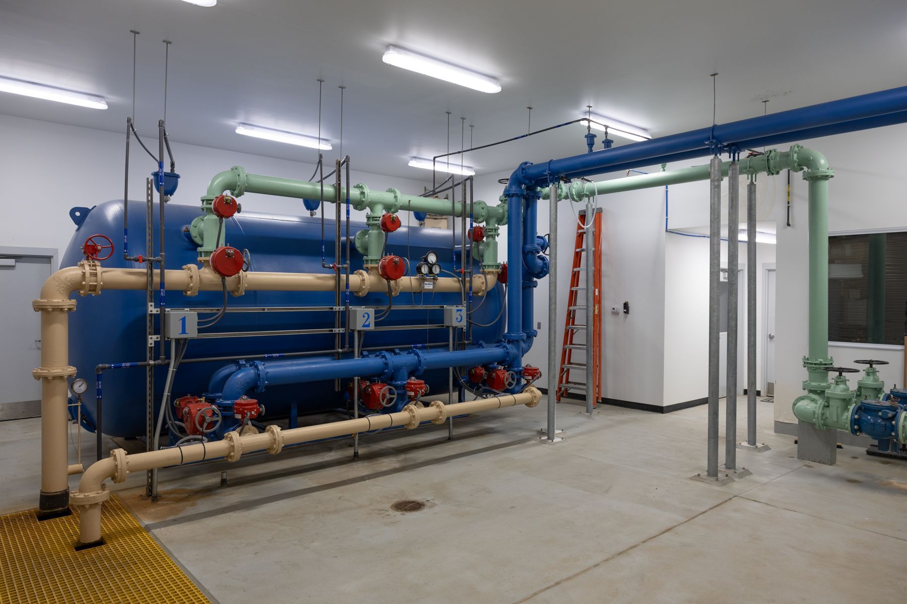 A room filled with lots of pipes and valves