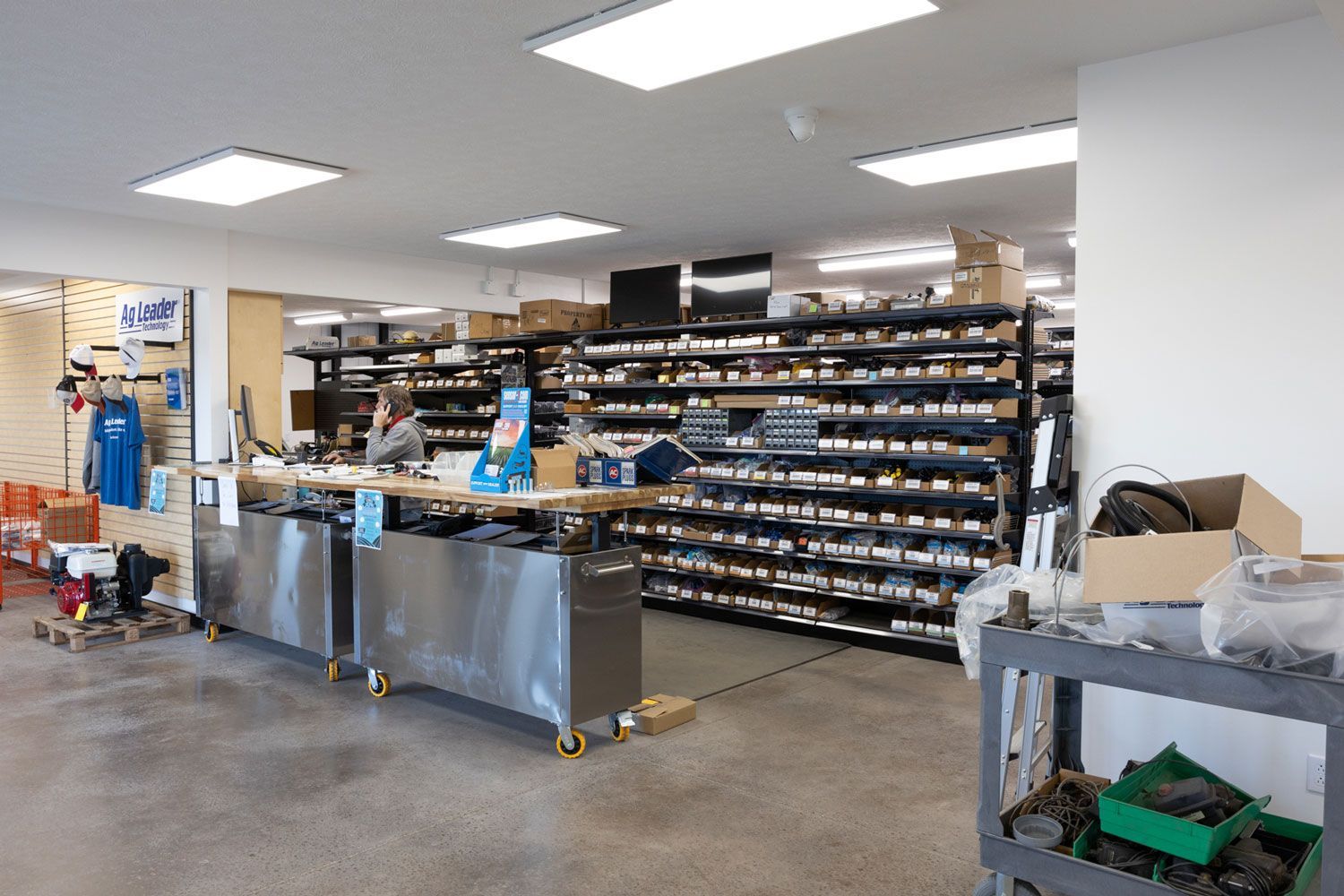 A store with a lot of shelves and boxes on the floor