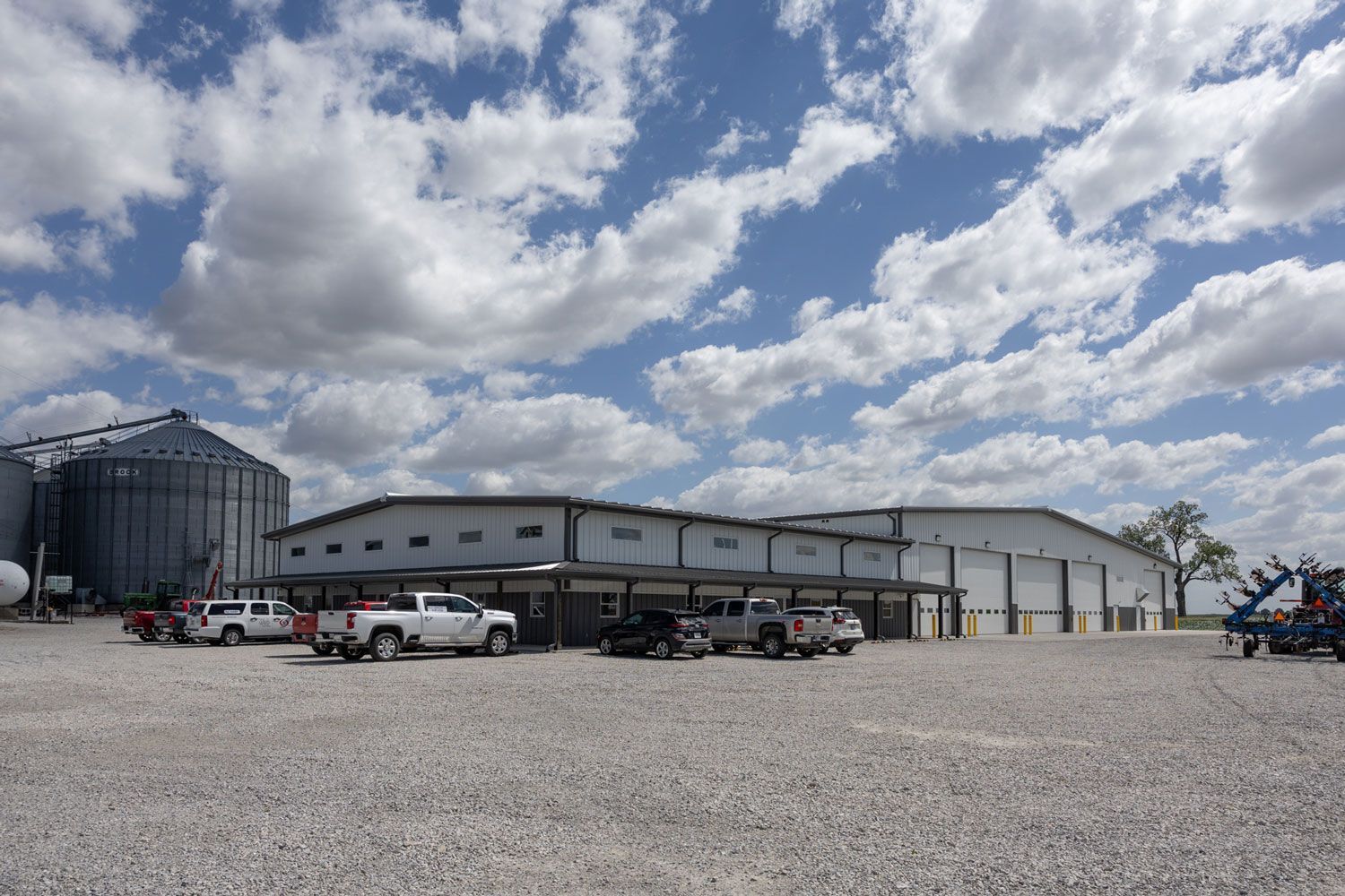 A large building with a lot of trucks parked in front of it