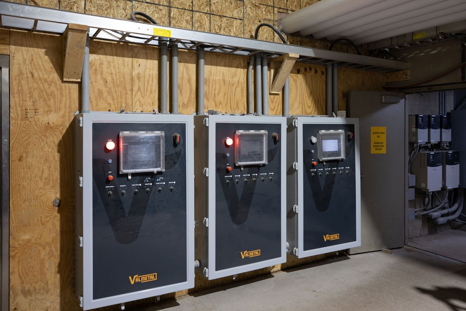 A row of electrical boxes with the word vega on them