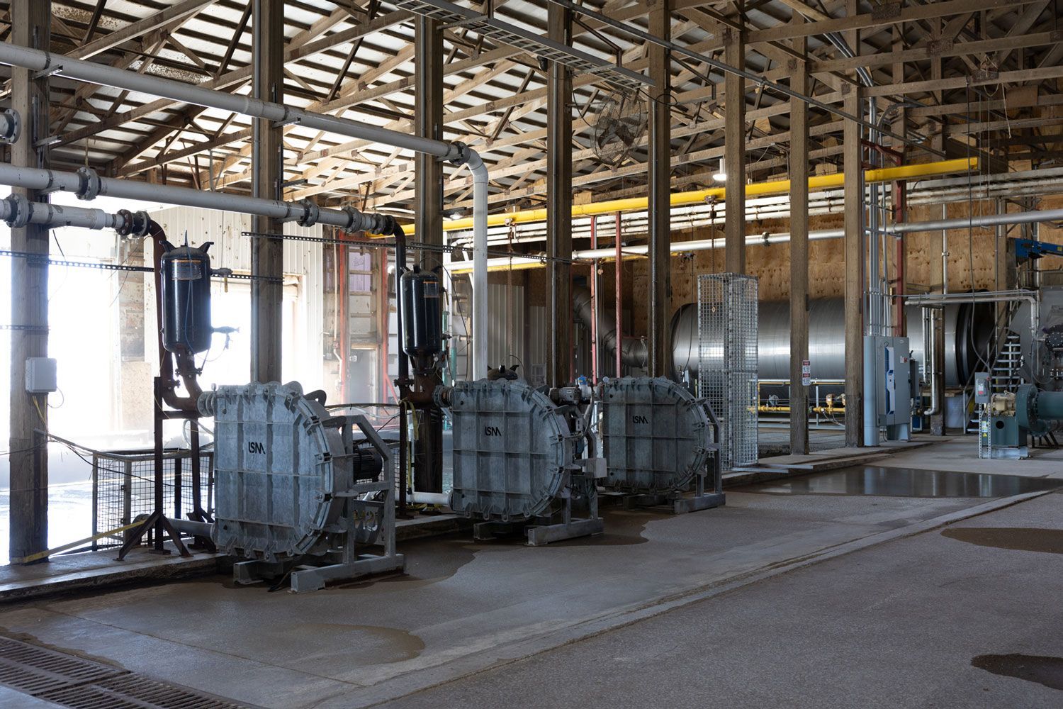 A factory with a lot of pipes and machinery