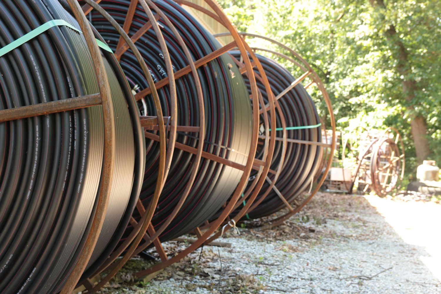 A bunch of pipes are stacked on top of each other