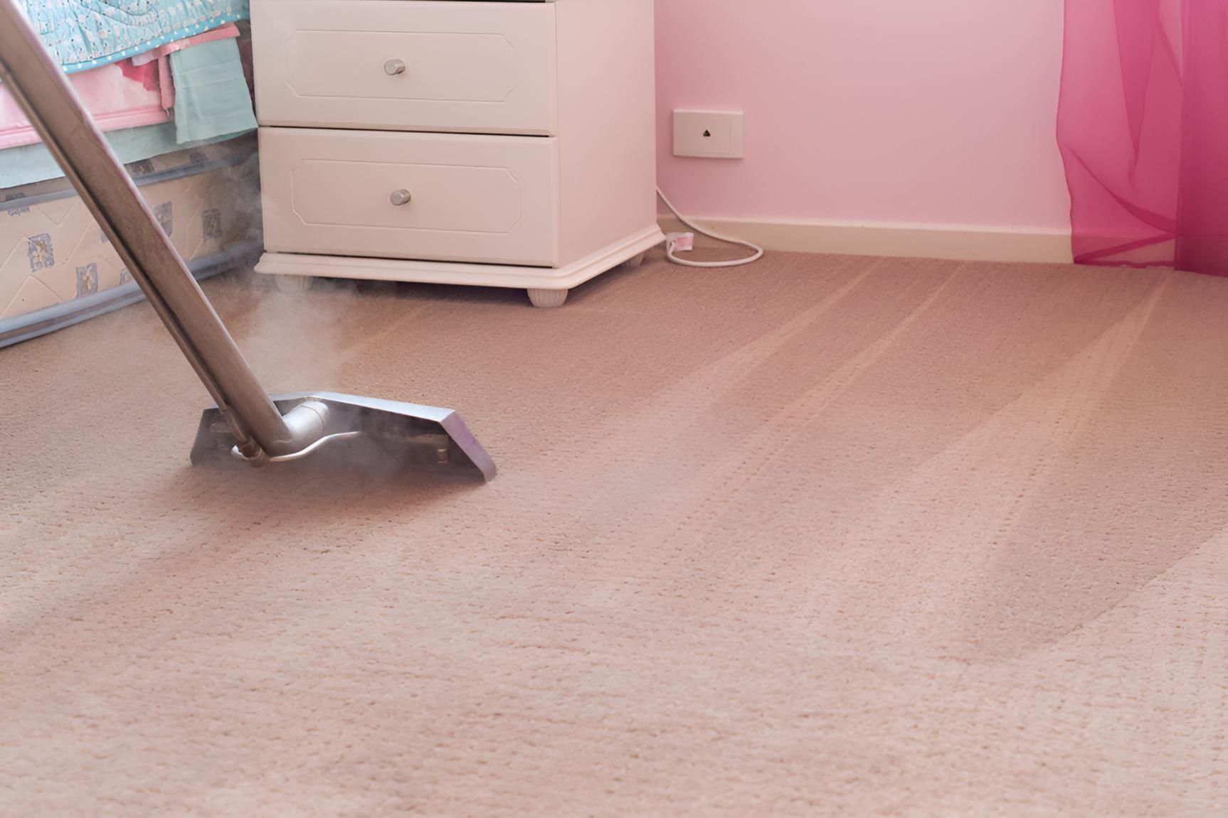 Vacuum Cleaner is Cleaning a Carpet in a Bedroom — Mr Steam Clean Tweed Coast in Murwillumbah, NSW