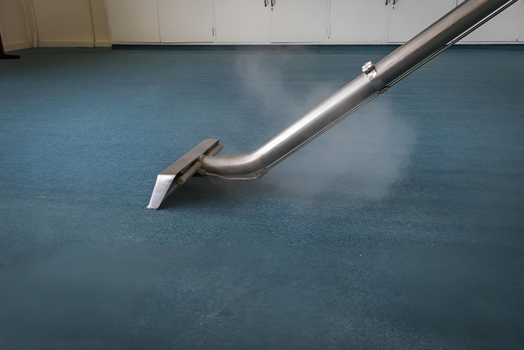 Vacuum Cleaner is Cleaning a Blue Carpet in a Room — Mr Steam Clean Tweed Coast in Northern Rivers, NSW