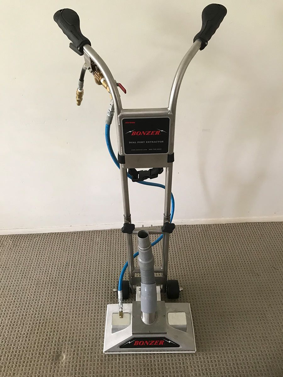 A Machine That Cleaning For A Carpet Is Sitting On A Carpet — Mr Steam Clean Tweed Coast In Tweed Heads, NSW