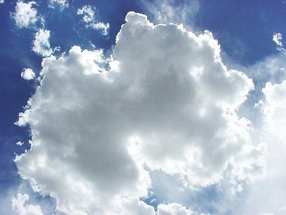Puffy white cloud and blue sky