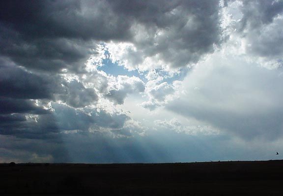 rays of sunshine beaming down through the clouds
